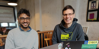 Goutam Das and Sven Seeberg with a laptop