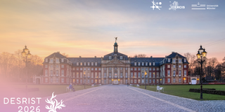A wide panoramic shot of the Prince-Bishop's Palace in Münster, Germany, captured during a soft sunset. The grand Baroque building features a red brick facade contrasted by decorative elements, window frames, and cornices made of light-colored sandstone. A prominent central section houses an ornate entrance and a clock tower topped with a small golden statue. Symmetrical wings extend outward, ending in corner pavilions under dark slate roofs. In the foreground, a wide, light-colored cobblestone path leads directly toward the palace entrance in a straight perspective. The path is bordered by expansive green lawns featuring a few white park benches. Ornate, multi-lamp black streetlights stand at the far left and right edges. The sky above the palace displays a soft gradient ranging from pale orange and yellow at the horizon to a delicate light blue. In the upper right corner, three white logos are displayed: a technical node graphic, the "ERCIS" logo with a dotted map of Europe, and the "Universität Münster" logo. In the lower-left corner, a semi-transparent pinkish gradient overlays the scene, featuring the white text "DESRIST 2026" alongside a stylized, organic coral-like symbol.